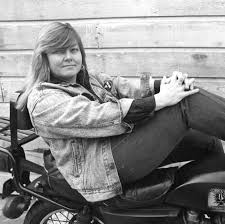 Dorothy Allison on a motorcycle