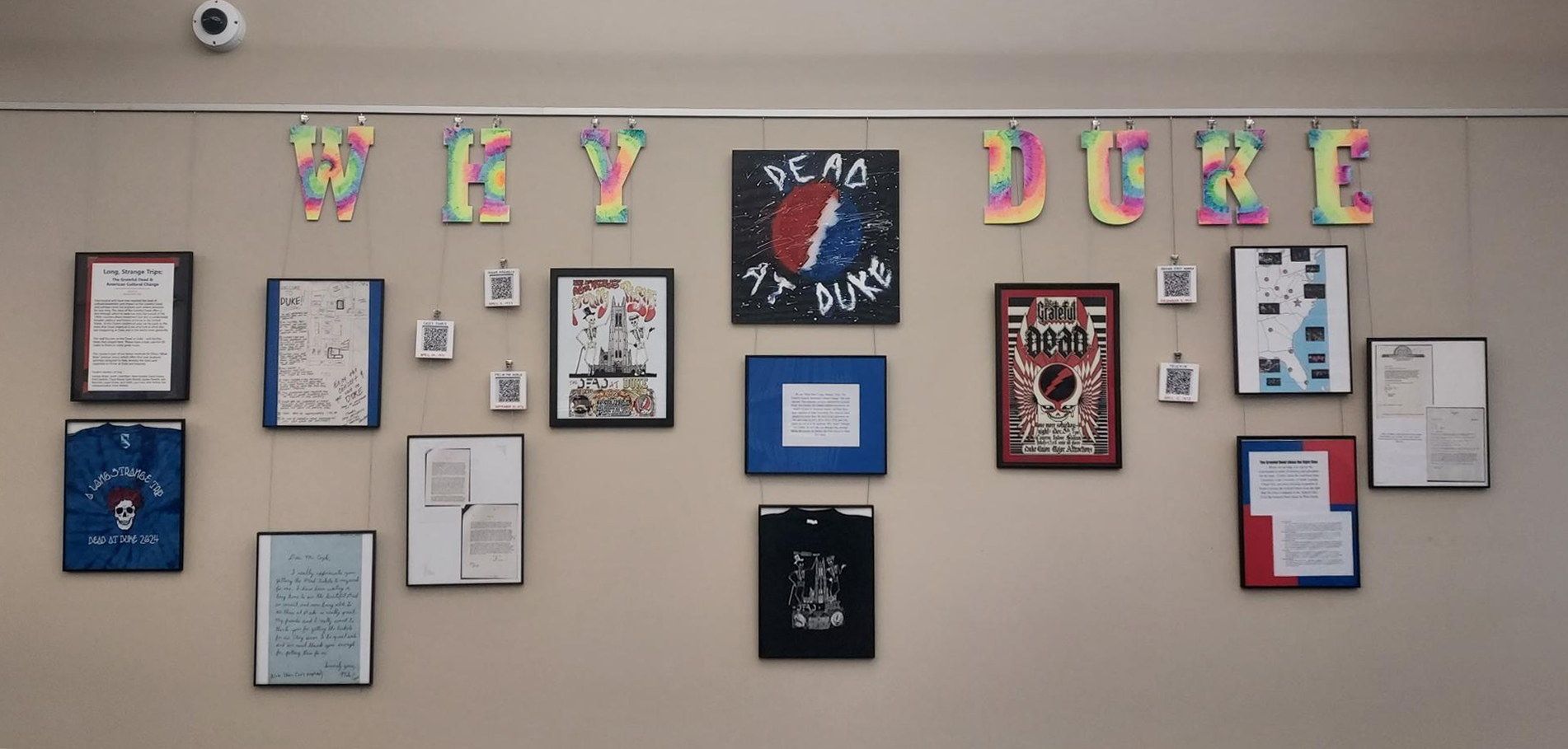 Exhibit wall displaying various exhibit frames and 'Why Duke' title panels.