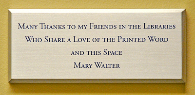 Plaque reads, 'Many thanks to my friends in the Libraries who share a love of the printed word and this space. -Mary Walter'
