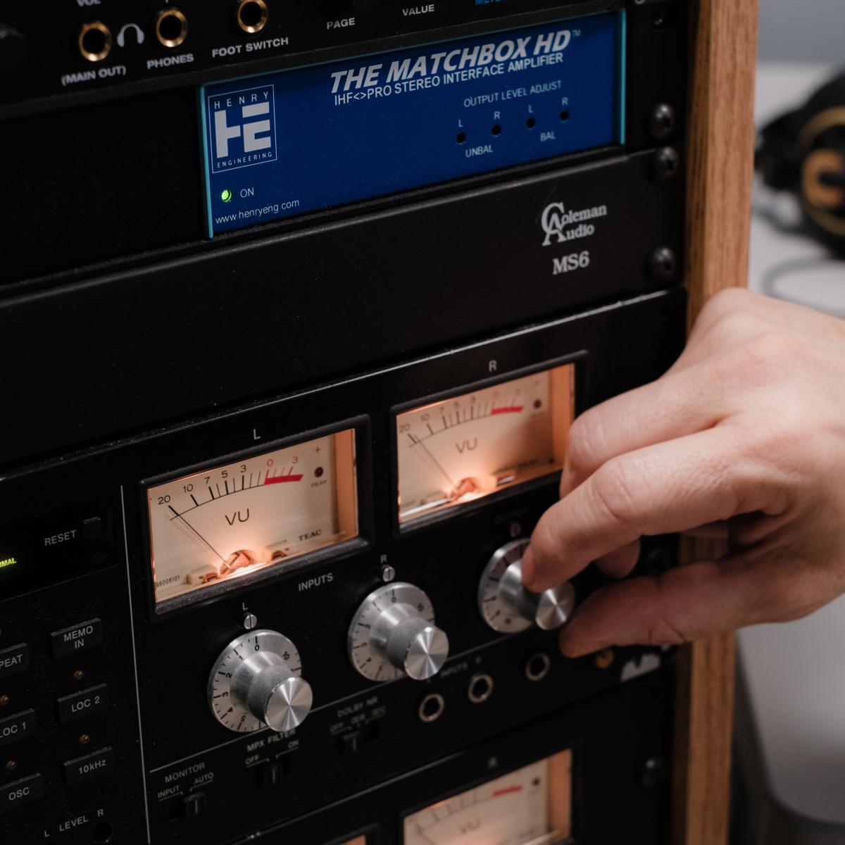 close up of staff member adjusting audiovisual equipment