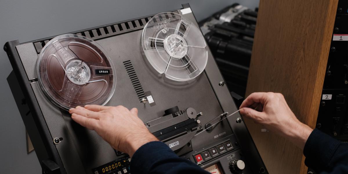 staff member using an otari reel to reel tape deck