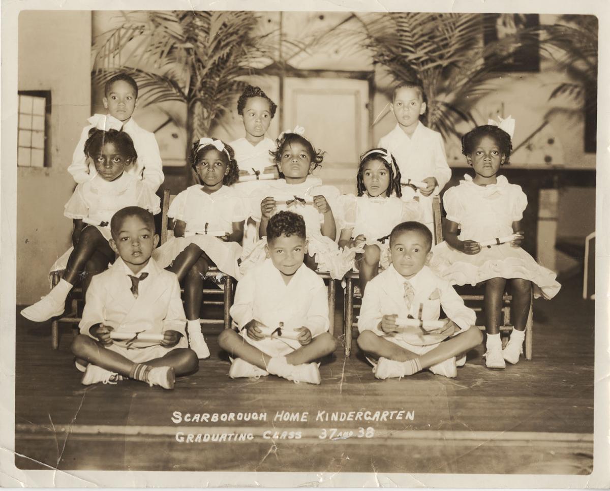 Black and white photograph showing eleven young black children lined up for a school photo. At the bottom someone has hadwritten "Scarborough Home Kindergarten. Graduating Class 37 and 38."